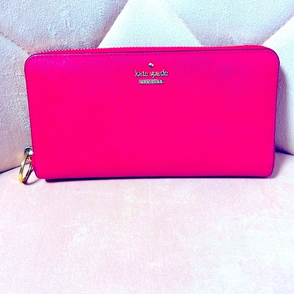 kate spade Handbags - NWOT, Authentic Kate Spade 100% leather Pink Ruby Wallet, excellent condition.